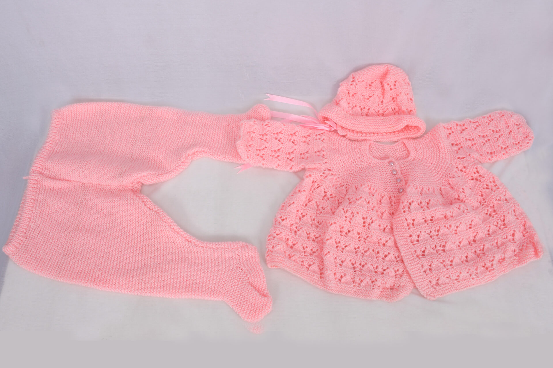 Pink Baby sweater set, complete with sweater, leggings and cap