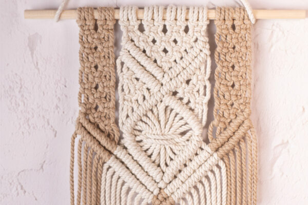 Transform your living space with our exquisite Handmade Dual Color Macrame Wall Hanging. Elevate your home decor with this meticulously crafted piece that seamlessly blends artistry and style. Handwoven with precision and love, each knot tells a unique story. Add a touch of bohemian elegance to your walls and let the intricate design become a focal point in any room. Discover the beauty of handmade craftsmanship with our dual-color macrame wall hanging – a perfect blend of creativity and charm.